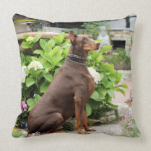 Doberman - In the Church Garden Throw Pillows