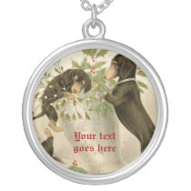 Dogs playing with Christmas mistletoe & holy berry necklaces