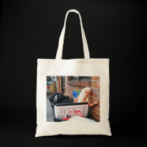 Doll in Trash Tote bags