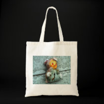 Doll on Ground Tote bags