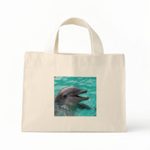 Dolphin head in aquamarine water tote bags