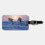 Dolphins at sunrise luggage tag
