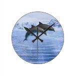 Dolphins in the clear blue sea wallclocks
