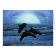 Dolphins playing at moonlight greeting card