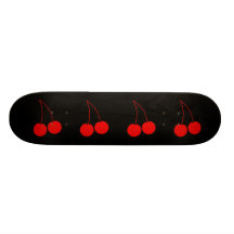 Dos cerezas rojas en negro tabla de patinar
