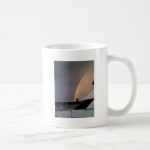 Double rainbow at sea coffee mug