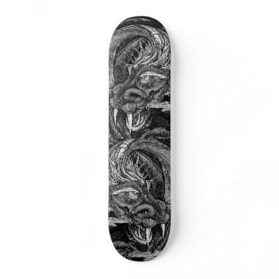 Skatebooard with black and white design showing two dragon heads.