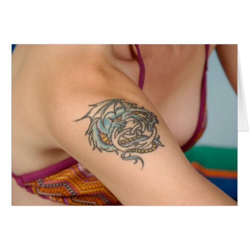 On a woman a dragon tattoo can represent a flowing fluid grace that 
