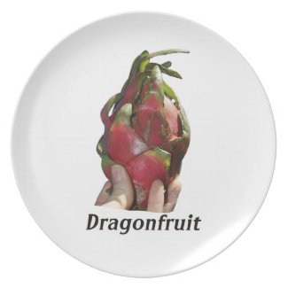 Dragonfruit held in fingers with text photo Pitaya plate