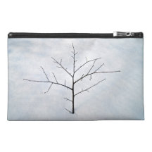 Dried branch lonely tree on a snowy landscape travel accessories bags