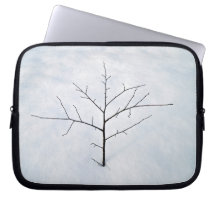 Dried branch lonely tree on a snowy landscape computer sleeves