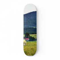 Drinking Cows On Pasture With A Hill In The Backgr skateboards
