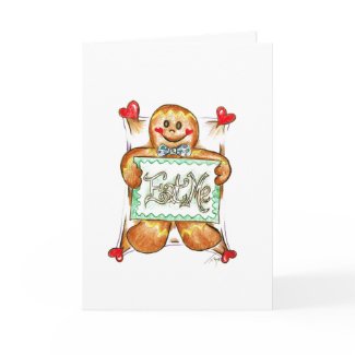 A gingerbread cookie that has "Eat Me" written in frosting