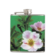 Elegant, fresh wild pink rose flowers in green hip flask