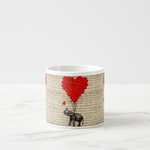 Elephant holding heart shaped balloons espresso cups