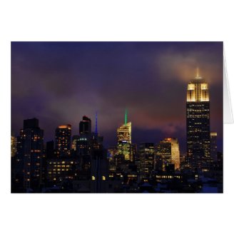 Empire State Building glows in clouds and fog Card