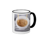 Espresso pouring into cup coffee mug