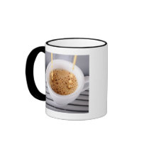 Espresso pouring into cup coffee mug