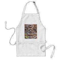Face In Stone On Buildings Wall aprons by lifesphere Face In Stone On Buildings Wall aprons