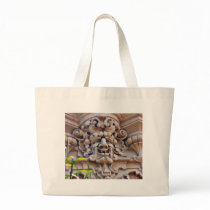 Face In Stone On Buildings Wall bags
