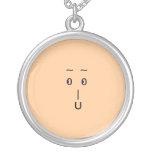 Face on necklace