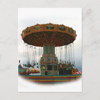Fairgrounds Swings Stopped Against Grey sky postcard