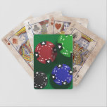 Falling Poker chips on Felt playing cards
