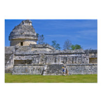 Family of tourists walk past ancient Mayan