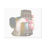 female hand holding four string bass neck faded gallery wrap canvas
