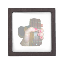 female hand holding four string bass neck faded premium trinket boxes