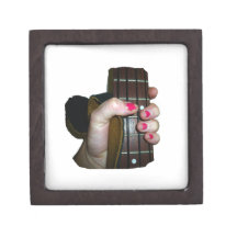 Female hand holding four string bass neck premium jewelry box