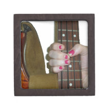 female hand holding four string bass neck premium trinket box