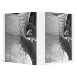 Female hand lacing up wedding dress back vinyl binder