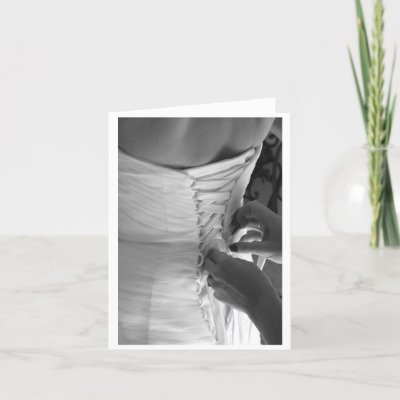 Female hand lacing up wedding dress back greeting card