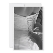 Female hand lacing up wedding dress back custom invites