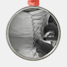 Female hand lacing up wedding dress back christmas tree ornaments