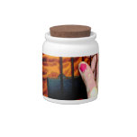 female hand pulling bass string 1 posterized candy jar