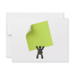 Figurine holding a piece of blank yellow paper personalized invites