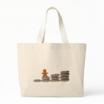 Figurine on stack of pebbles canvas bags