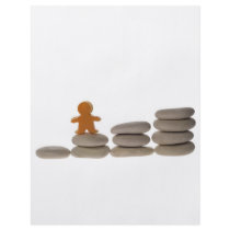 Figurine on stack of pebbles full color flyer