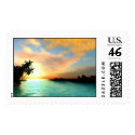 This postage stamp has a picture of a flaming sky tropical scenery stamp