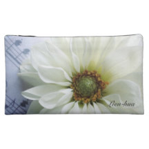 flor blanca en bolso del cosmético de la música