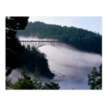 Fog drifts under the Deception Pass bridge at Postcard