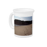 Footprints in beach sand beverage pitchers