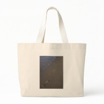Footprints in the sand canvas bags