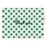 Four leaf clovers in green cards