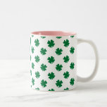 Four leaf clovers in green coffee mugs
