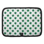 Four leaf clovers in green organizer