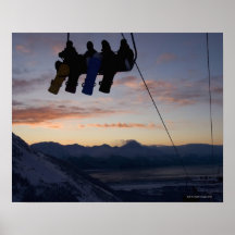 Four snowboarders are silhouetted on a ski lift print