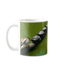 Four Turtles Trying to Cross a Log with Duck Block Coffee Mug